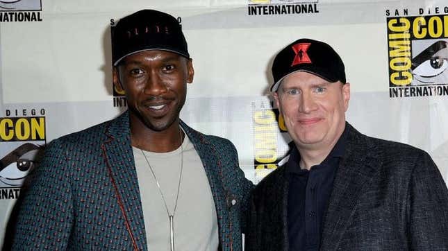 Mahershala Ali wearing a Blade hat stands next to Kevin Fiege