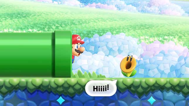 A Super Mario Bros. Wonder screenshot shows Mario peeking out of a green pipe. 