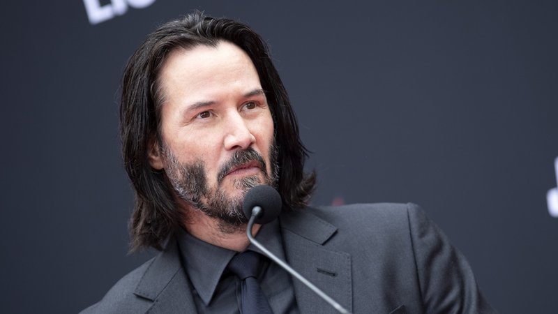 Keanu Reeves in a black suit