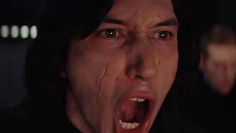 Adam Driver as Kylo Ren in the movie Star Wars with his mouth open in a shout