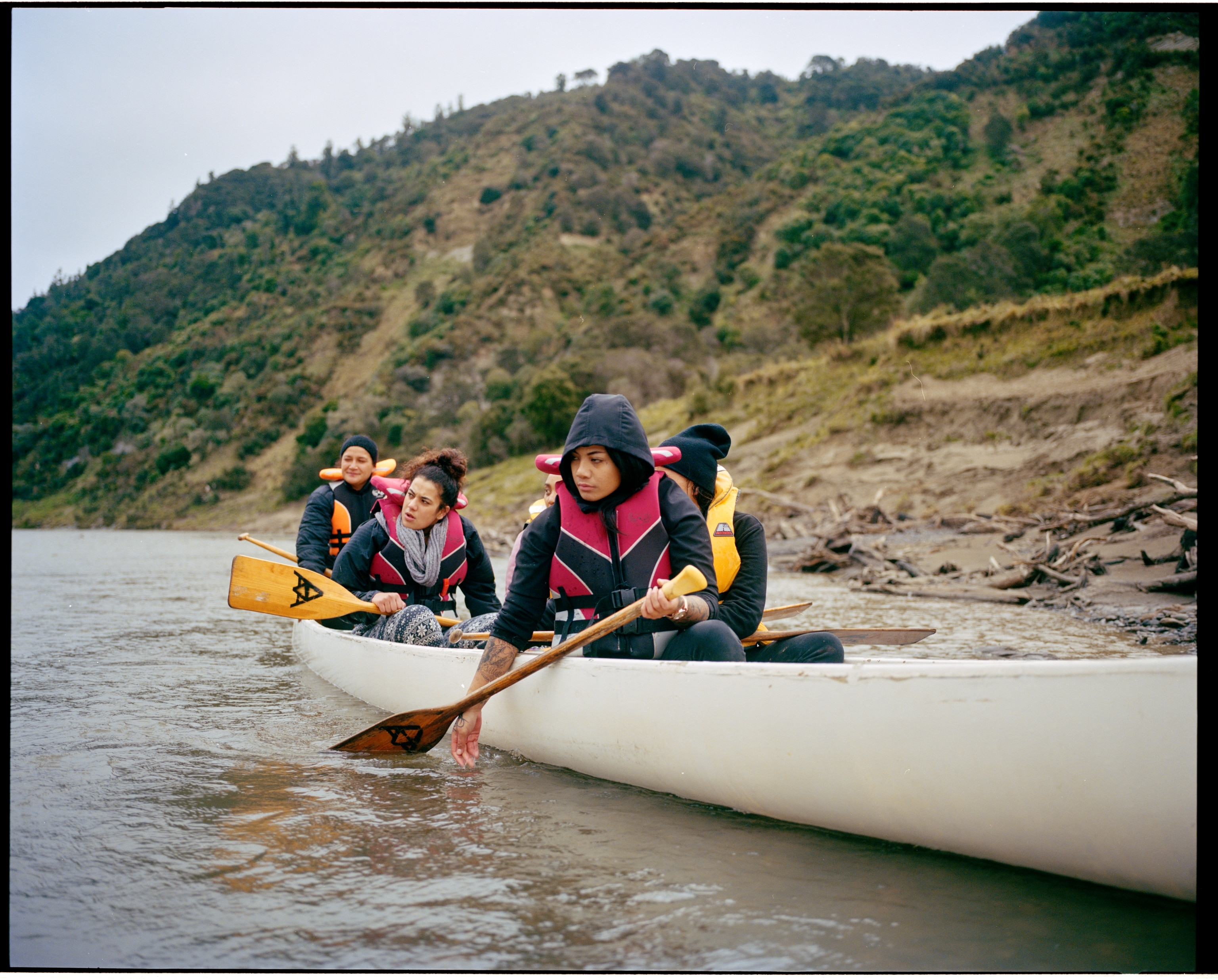 Maori teenagers canoe down the Whanganui River