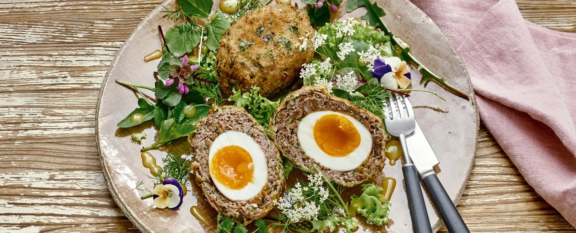 Scotch eggs with salad of wild greens