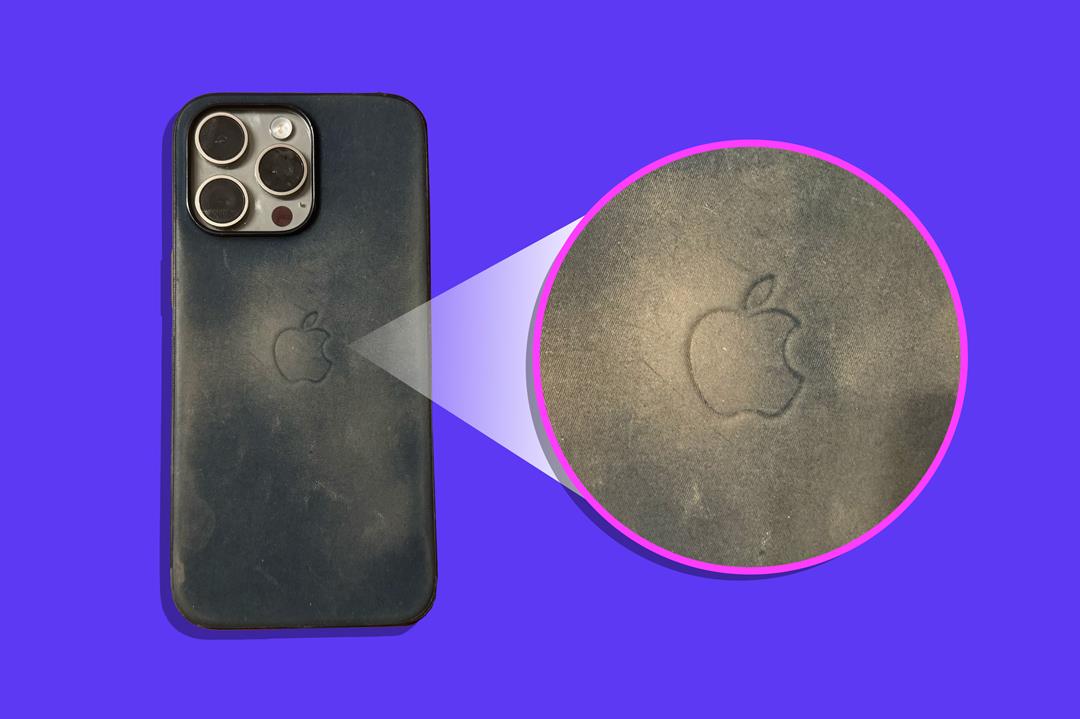 An image of the outside of a dirty iPhone 15 Pro Max case on a purple background. There is a pink circle to the right with a close up of the dirty case's Apple logo.