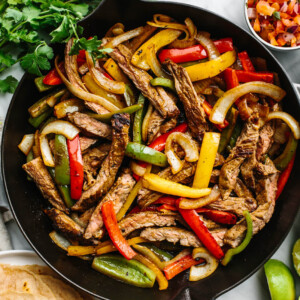 A skillet of steak fajitas