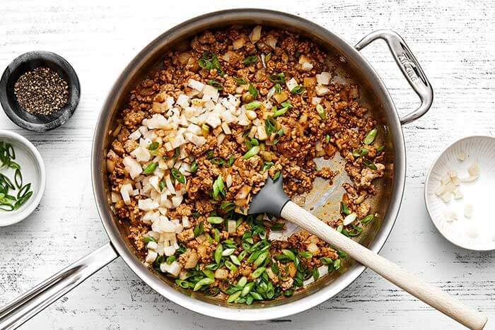 Cooking minced meat mixture for lettuce wraps.