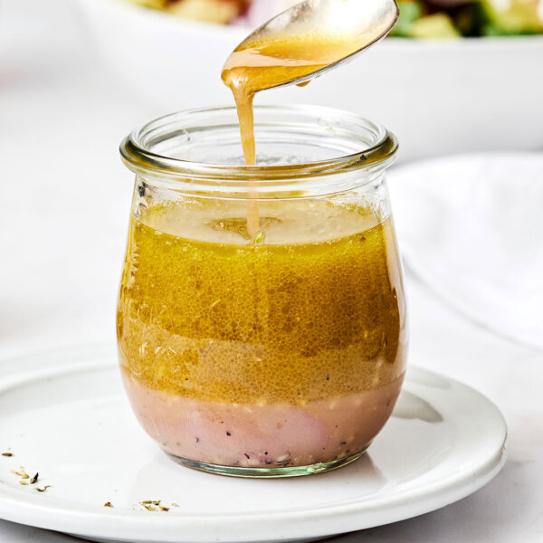 A jar of Greek salad dressing.