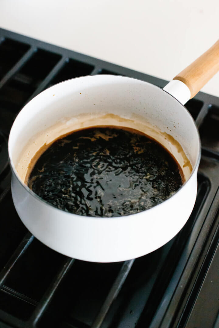 Reducing balsamic vinegar in a pot on the stove