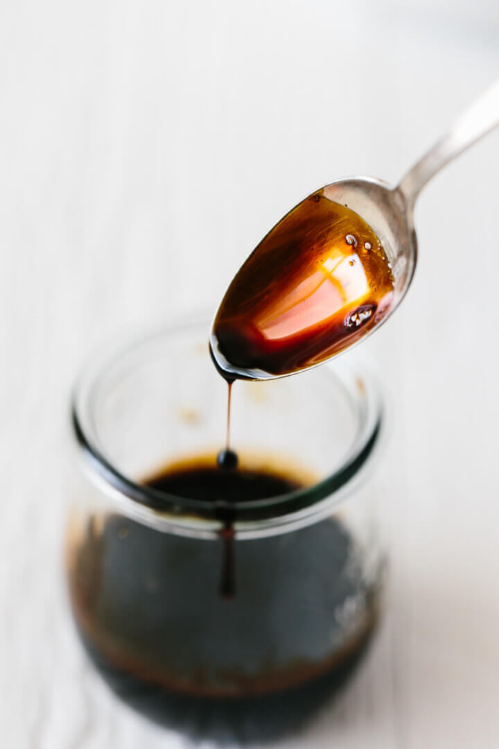 Balsamic glaze dripping off a spoon