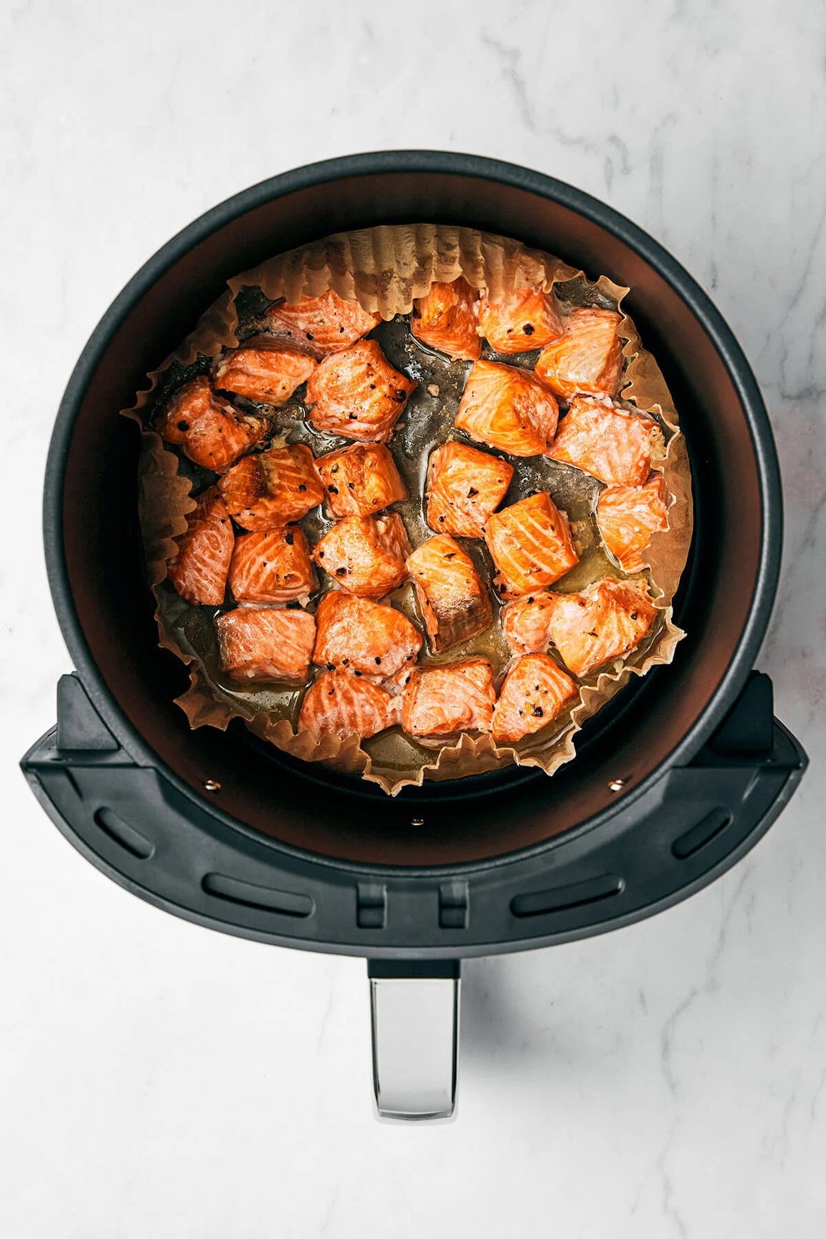 Air fryer salmon bite in air fryer basket