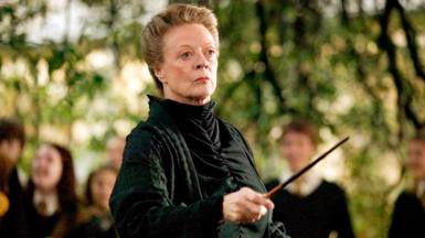 Dame Maggie Smith holding a wand in Harry Potter and the Goblet of Fire