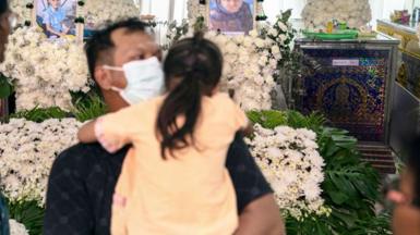 Relatives mourn victims of school bus fire in Thailand