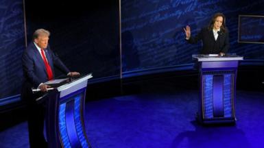 Kamala Harris speaks during a presidential debate hosted by ABC as Donald Trump listens,  10 September 2024