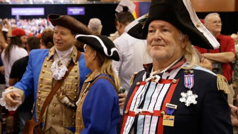 Trump supporters await the start of his rally in Phoenix, Arizona