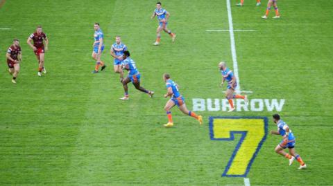 Headingley Stadium with a tribute to Rob Burrow on the pitch during a game