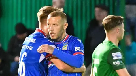 Kirk Millar celebrates scoring for Linfield