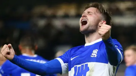 Alfie May celebrates his winner for Birmingham against Huddersfield