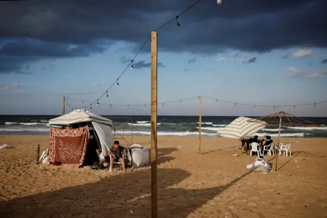 Some displaced people are living in shelters on the beach (this picture does not show those quoted in the above post)