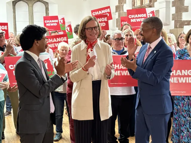 Catherine Fookes celebrates winning with Welsh Labour leader Vaughan Gething and new Vale of Glamorgan MP Kanishka Narayan