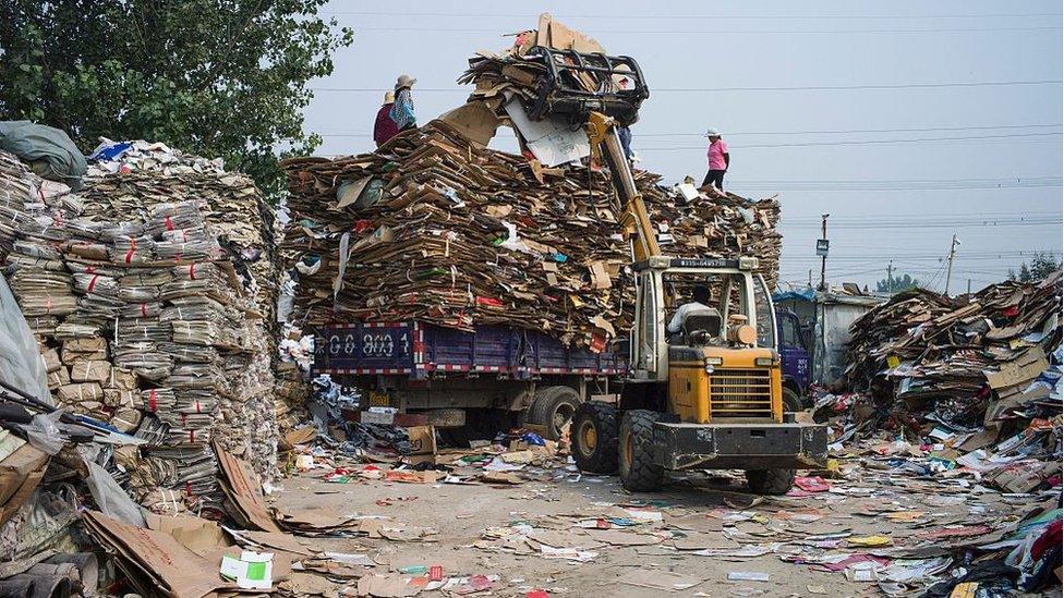 Paper and cardboard being prepared for recycling in China