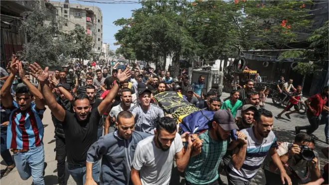 People attend the funeral ceremony of Palestinians, who lost their lives in Israel's attacks, in Rafah, Gaza on August 07, 2022