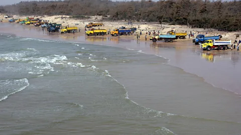 Getty Images Criminal gangs have found that illegally extracting sand from beaches or quarries and selling it on the black market is a lucrative business (Credit: Getty Images)