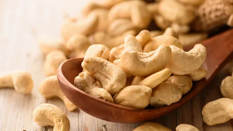 Getty Images Cashew nuts are one of the most water-intensive nuts to grow - some 909 gallons (4,134 litres) of water per kilogram of shelled nuts (Credit: Getty Images)