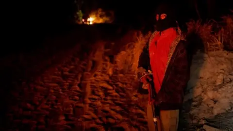 Reuters Paulo Paulino Guajajara holds a gun during the search for illegal loggers in September