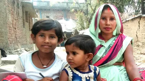 Shiv Kumar Laxmi (left) with her mother and sister