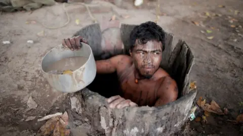 Reuters Paulo Paulino Guajajara draws water from a well at a loggers camp on Arariboia indigenous land near the city of Amarante, Maranhao state, Brazil.