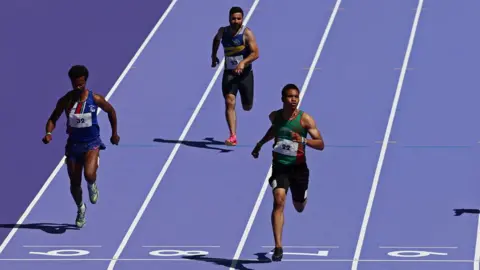 Athletes testing the track at the Stade de France for the Paris Olympics