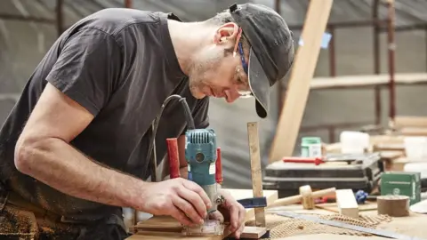 Getty Images Stock shot of a carpenter at work