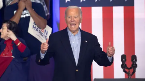 Joe Biden in front of American flag