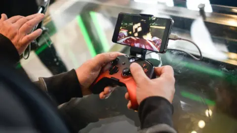 Getty Images A customer plays on an Xbox xCloud device at the Microsoft store