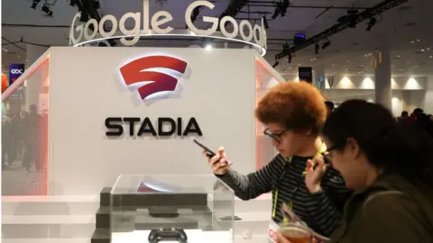 Getty Images Attendees look at the new Stadia controller on display at the Google booth at the 2019 GDC Game Developers Conference on March 20, 2019 in San Francisco, California.