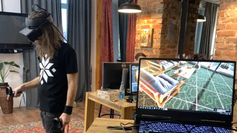 Promethean Developers Promethean developer working with a VR headset