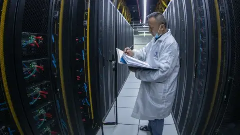 Getty Images A technician at a data centre in China