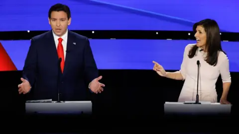 Getty Images Republican presidential candidates Florida Governor Ron DeSantis and former UN Ambassador Nikki Haley participate in the CNN Republican Presidential Primary Debate in Sheslow Auditorium at Drake University on January 10, 2024 in Des Moines, Iowa