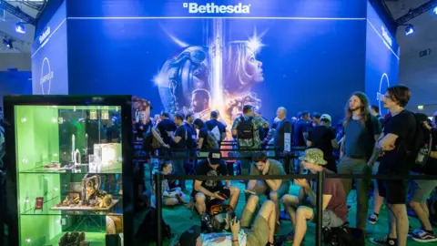 EPA-EFE Gamers queue up to play Bethesda's Starfield at Gamescom 2023