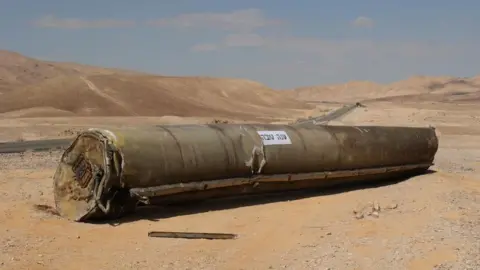 The wreckage of an Iranian ballistic missile outside the city of Arad, southern Israel, 02 October 2024