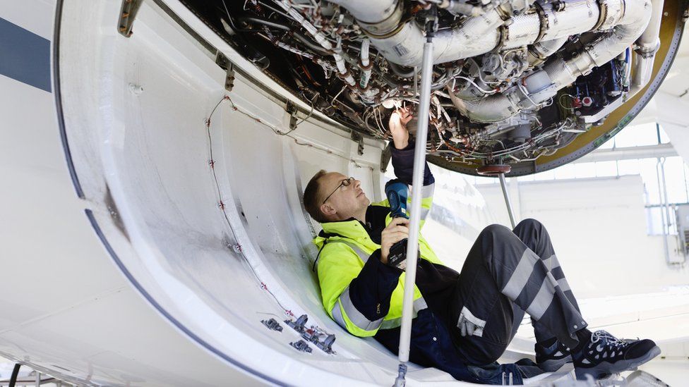 Engineer working on an engine