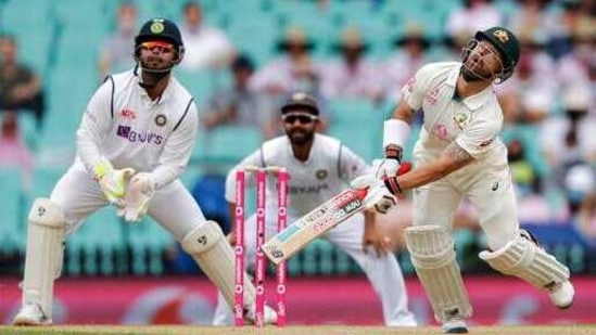 Australia's Matthew Wade, right, watches as he hits the ball to India's Jasprit Bumrah to be out caught during play on day two of the third cricket test between India and Australia at the Sydney Cricket Ground.(AP)