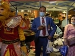 A performer wearing a monkey costume performs for tourists at a night market in the old city in Kashgar, Xinjiang Uyghur Autonomous Region, China on May 2. In the city of Kashgar, as Uyghur musicians serenaded tourists from the balcony of a picturesque tea shop, around a dozen police carrying shields and batons emerged from surrounding alleyways in an afternoon shift change.(Thomas Peter / REUTERS)