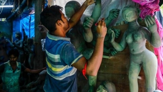 With Durga Puja just around the corner, artists all over India are giving finishing touches to the idols before they are taken to pandals, temples and homes where the rituals take place.(AP)