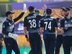 New Zealand's Trent Boult, third right, is congratulated by teammates after taking the wicket of Afghanistan's Hazratullah Zazai during the Cricket Twenty20 World Cup match between New Zealand and Afghanistan in Abu Dhabi, UAE, Sunday, Nov. 7, 2021. (AP Photo/Kamran Jebreili)(AP)