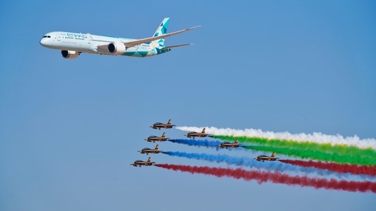 Dubai's biennial Air Show kicked off in style on November 14 at the Al Maktoum airport, a second and smaller international hub to Dubai's main airport, which is the world's busiest for international travel. In this still, an Etihad Boeing 787 Dreamliner flies alongside the Emirati Forsan military stunt flying team at the Dubai Air Show in Dubai, United Arab Emirates on November 14.(AP)