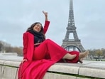 The weather in Paris is currently 6 degrees Celsius and cloudy but braving the cold in ‘the City of Love’ is Bollywood singing sensation Neha Kakkar who delayed winters single-handedly with her smoking hot look in a red outfit as she soaked in the love vibes and posed before the foggy Eiffel Tower.(Instagram/nehakakkar)