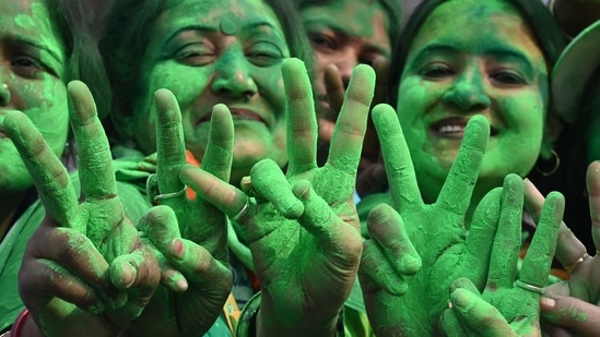 Trinamool Congress (TMC) supporters on Tuesday celebrated the party's victory in the Kolkata Municipal Corporation (KMC) elections, near West Bengal Chief Minister and TMC leader Mamata Banerjee's residence in Kolkata.(AFP)