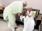 Prime Minister Narendra Modi visited his mother Heeraben Modi at her residence in Gujarat's capital city Gandhinagar on Friday after Bharatiya Janata Party's (BJP) big win in four states.(ANI)