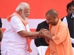 Yogi Adityanath with Prime Minister Narendra Modi at Lucknow's Ekana Stadium on Friday, March 25, 2022. Adityanath took oath as the chief minister of Uttar Pradesh for a record second term. (Photo by Deepak Gupta/Hindustan Times)