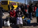 People wait for a bus to go in a train station in Severodonetsk, eastern Ukraine as they flee the city in the Donbas region. The United Nations estimates that 7.1 million people have been displaced within the country, according to figures published by the IOM on April 5.(Photo by FADEL SENNA / AFP)